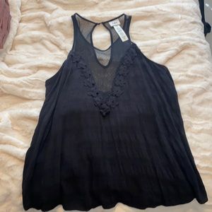 Black tank top with deep floral/mesh v-neck
